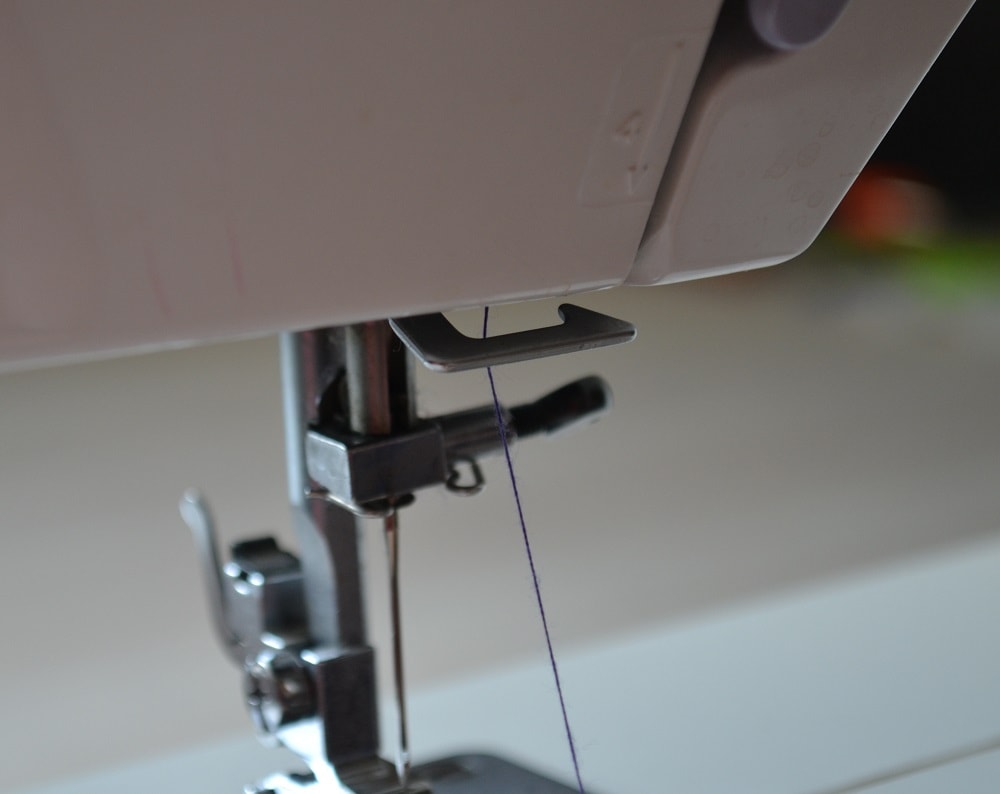 Slide the thread through all hooks