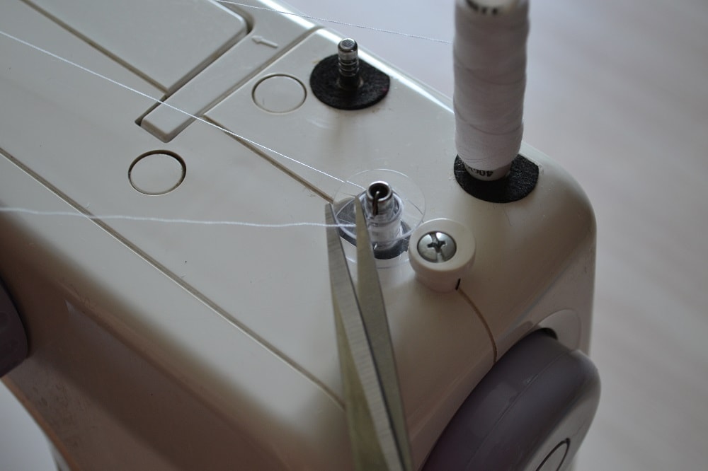 Cut off excess thread end