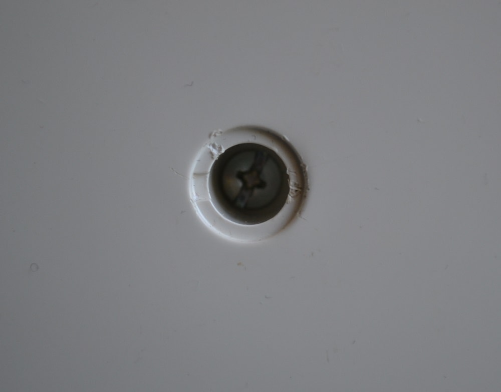 How to turn out screw of cover