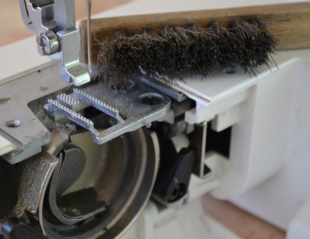 Brush for cleaning shuttle hook