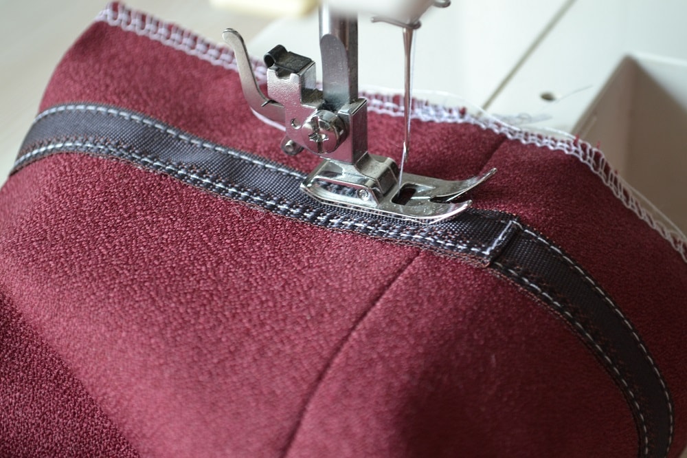 Final stage of sewing the kick tape