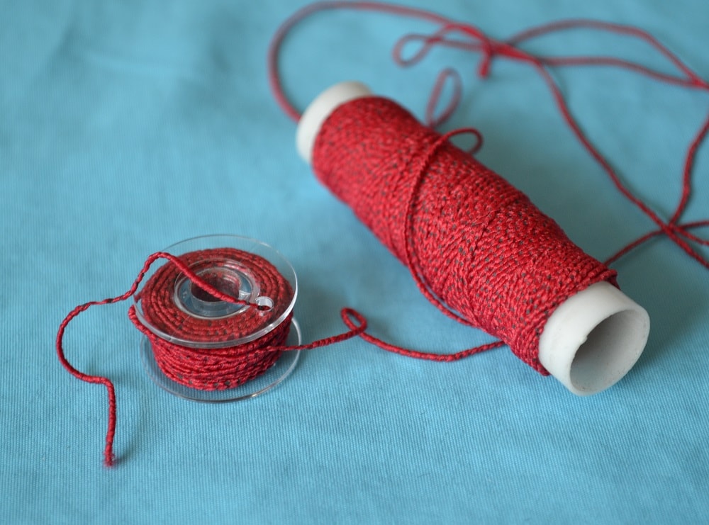 Bobbin with elastic thread