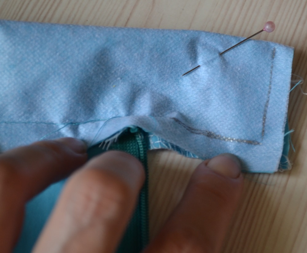 Fold opposite side of waistband in half