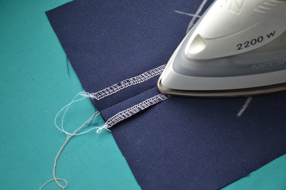 Press the seam open on wrong side a fabric